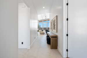 Hall featuring baseboards and recessed lighting
