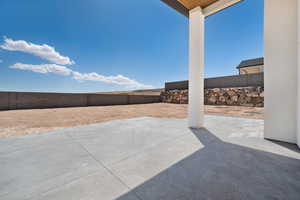 View of patio with a fenced backyard