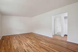 Spare room with light wood finished floors and baseboards