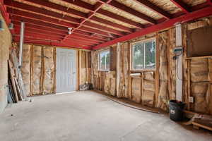 Misc room with unfinished concrete floors