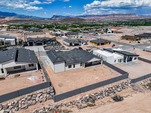 Aerial view of residential area featuring a mountainous background