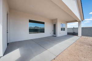 View of patio with fence