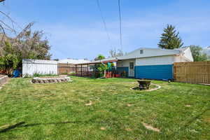 View of yard featuring an outbuilding and a storage shed