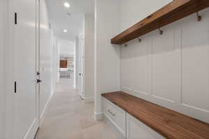 Mudroom with recessed lighting and baseboards