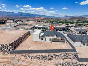 Aerial perspective of suburban area with a mountain backdrop