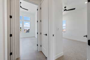 Hall featuring baseboards