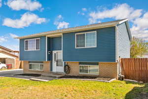 Split foyer home with brick siding