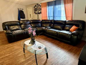 Living room featuring wood finished floors