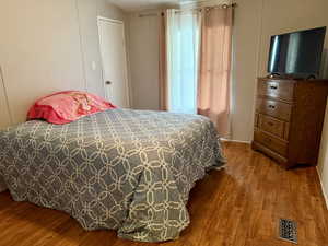 Bedroom featuring wood finished floors