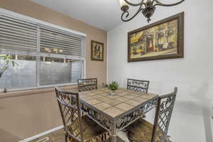 Dining area with a chandelier