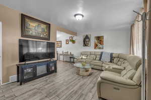 Living area featuring light wood-type flooring