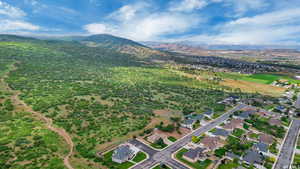Aerial view of property's location featuring a mountain backdrop