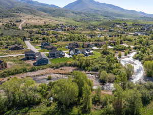 Aerial perspective of suburban area featuring a mountainous background