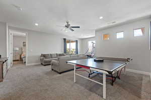 Playroom featuring ceiling fan, recessed lighting, baseboards, and light colored carpet