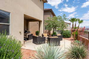 View of patio featuring an outdoor hangout area