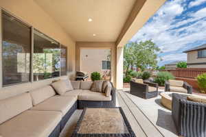 View of patio / terrace with an outdoor living space, area for grilling, and fence