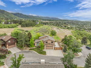 View of subject property with a mountain backdrop