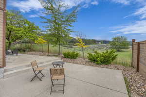 View of patio / terrace featuring a fenced backyard and a mountain view