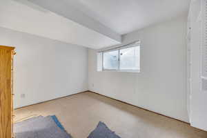 Empty room featuring tile patterned floors
