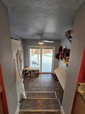 Mudroom featuring lots of storage and sliding glass doors to backyard