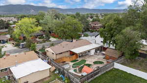 Aerial perspective of suburban area featuring a mountainous background