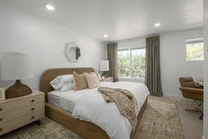 A tranquil bedroom with soft natural light, perfect for rest and relaxation. *Model