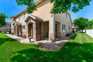 View of side of property featuring stone siding, stucco siding, and central air condition unit