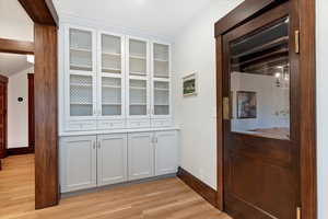 Detailed view of wood finished floors and baseboards