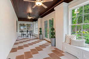 Sunroom featuring french doors