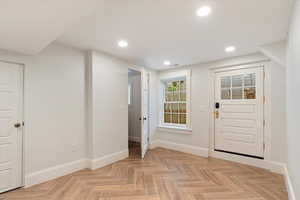 Foyer entrance featuring baseboards and recessed lighting