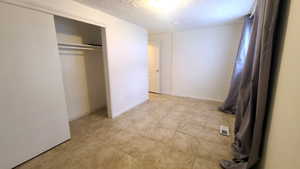 Bedroom featuring light pattern tile floor.