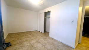 Bedroom featuring light pattern tile floor