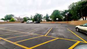 Large Fenced Parking with community basketball court