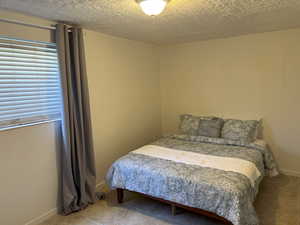 Bedroom featuring light pattern tile floor.