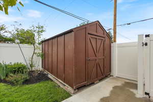 View of shed with fence
