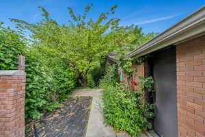 Brick home and surrounding wall
