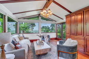 Sitting room off of kitchen with huge windows and access to balcony