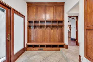 Mudroom has beautiful built-in storage