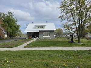 Two story house front yard and metal roof