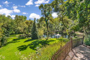 View of grassy yard featuring a water view