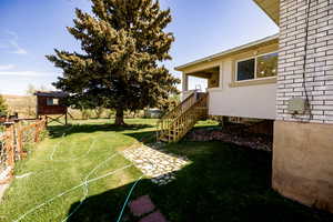 View of yard with fence