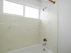 Bathroom with shower / washtub combination