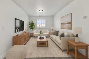 Living room featuring baseboards
