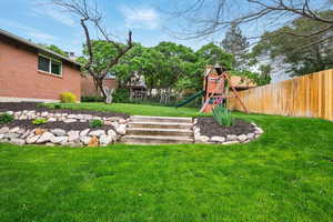View of yard with a playground