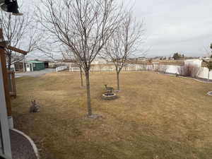 View of yard with a fire pit