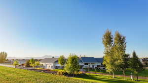 View of front facade with a front yard and a mountain view