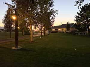 View of home's community featuring a yard