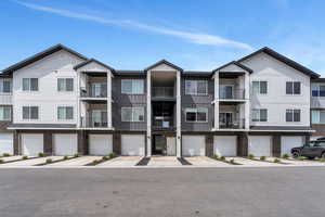 View of property featuring an attached garage