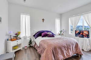 Bedroom featuring wood finished floors