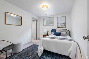 Carpeted bedroom with baseboards
